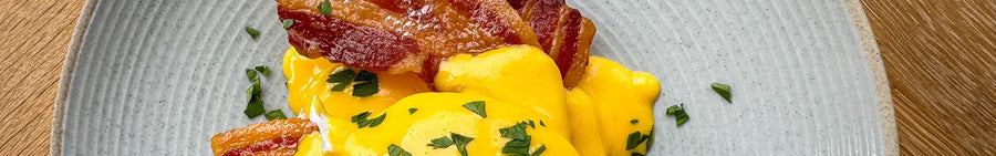 Eggs Benedict with crispy bacon