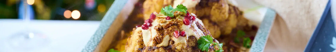 Whole Roasted Harissa Cauliflower with Hummus Dressing